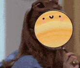 a woman with a magnifying glass covering her face with a smiley face