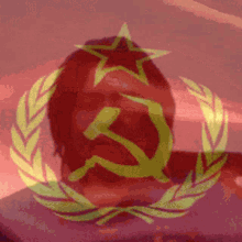 a hammer and sickle in a laurel wreath