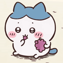 a cat with a blue bow on its head is holding a grape