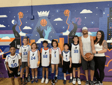 a group of young basketball players wearing jerseys with the letter y on them