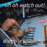 two men are fighting in a boxing ring with a budweiser banner in the background