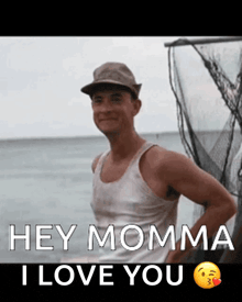 a man on a boat with the words hey momma i love you below him