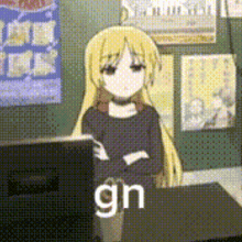 a girl with blonde hair is standing in front of a desk with the word gn on it