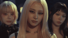 a woman with blonde hair has a nose ring