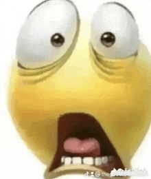 a close up of a cartoon smiley face with a surprised expression on its face .
