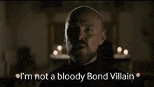 a bald man with a beard is saying `` i 'm not a bloody bond villain ''