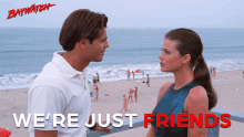 a poster for baywatch shows a man and a woman looking at each other on a beach