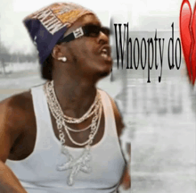 a man wearing sunglasses and a hat with the words whoopty do written on it