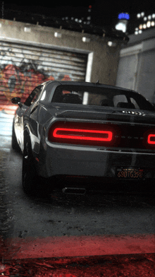 a dodge challenger is parked in a garage