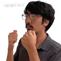 a man with glasses and a beard is making a funny face