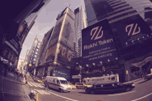 a busy city street with a sign for rokhi token in the foreground