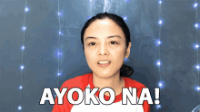 a woman in a red shirt says ayoko na