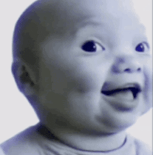 a baby making a funny face with its tongue out