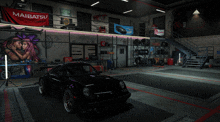 a black car is parked in a garage with a maibatsu banner