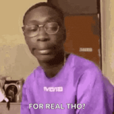 a man wearing glasses and a purple shirt is making a funny face and saying `` for real tho '' .