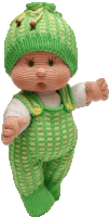 a crocheted doll with a green hat and overalls