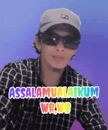 a man wearing sunglasses and a hat with the words assalamualaikum wrwb