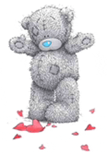 a teddy bear is standing next to a pile of hearts .