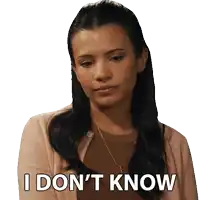 a woman says i don 't know while wearing a pink cardigan