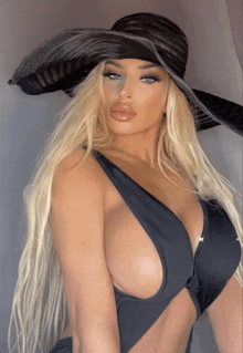 a woman wearing a black hat and a plunging neckline