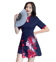 a woman in a blue dress holding a fan in her hand