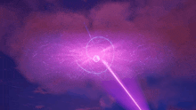 a purple laser beam is shining through a circle in the sky .