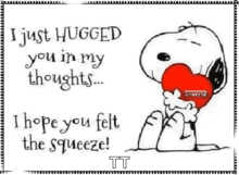 snoopy is holding a heart in his hands and says i just hugged you in my thoughts