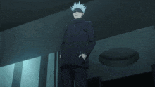 a man with white hair and a black jacket is standing in a dark room