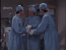 a group of doctors are standing in an operating room with the words doots written on the bottom