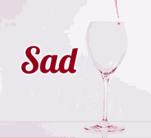 a sign that says no sad drinking with a glass of wine being poured