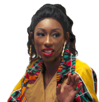 a woman wearing red lipstick and a colorful jacket waves her hand