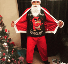 a man dressed as santa claus is wearing an angry bird t-shirt