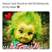 a picture of a baby grinch with the words merry christmas below it