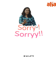 a woman in a plaid shirt says sorry sorry !!