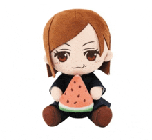 a stuffed toy of a girl holding a piece of watermelon