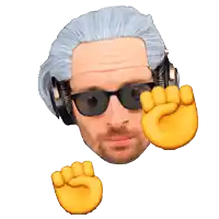 a man wearing headphones and sunglasses has a fist up