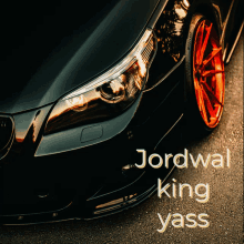 a close up of a black car with the words jordwal king yass on the bottom