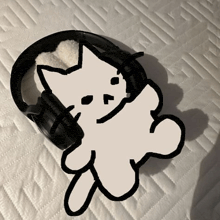 a black and white drawing of a cat and a pair of headphones
