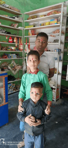 a man and two children pose for a photo in a store