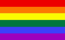 a close up of a rainbow flag on a white background