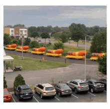 a row of cars are parked in a parking lot with a bunch of hot dogs on them