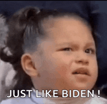 a little girl is making a funny face and saying `` just like biden ! ''