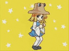 a girl wearing a frog hat is dancing on a yellow background .