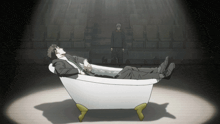 a man in a suit is laying in a bath tub