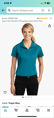 a woman wearing a blue polo shirt and black pants