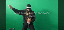 a man is dancing in front of a green screen with the words a big thank you to edgewick staff