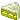 a close up of a green object on a white background