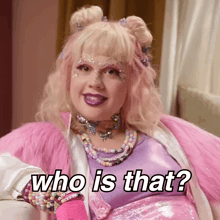 a woman in a pink and purple outfit says who is that