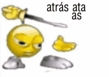 a yellow smiley face is holding a knife in his hand and says atras ata as .