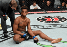 a man in a boxing ring with a jimmy john 's sandwich shop in the background